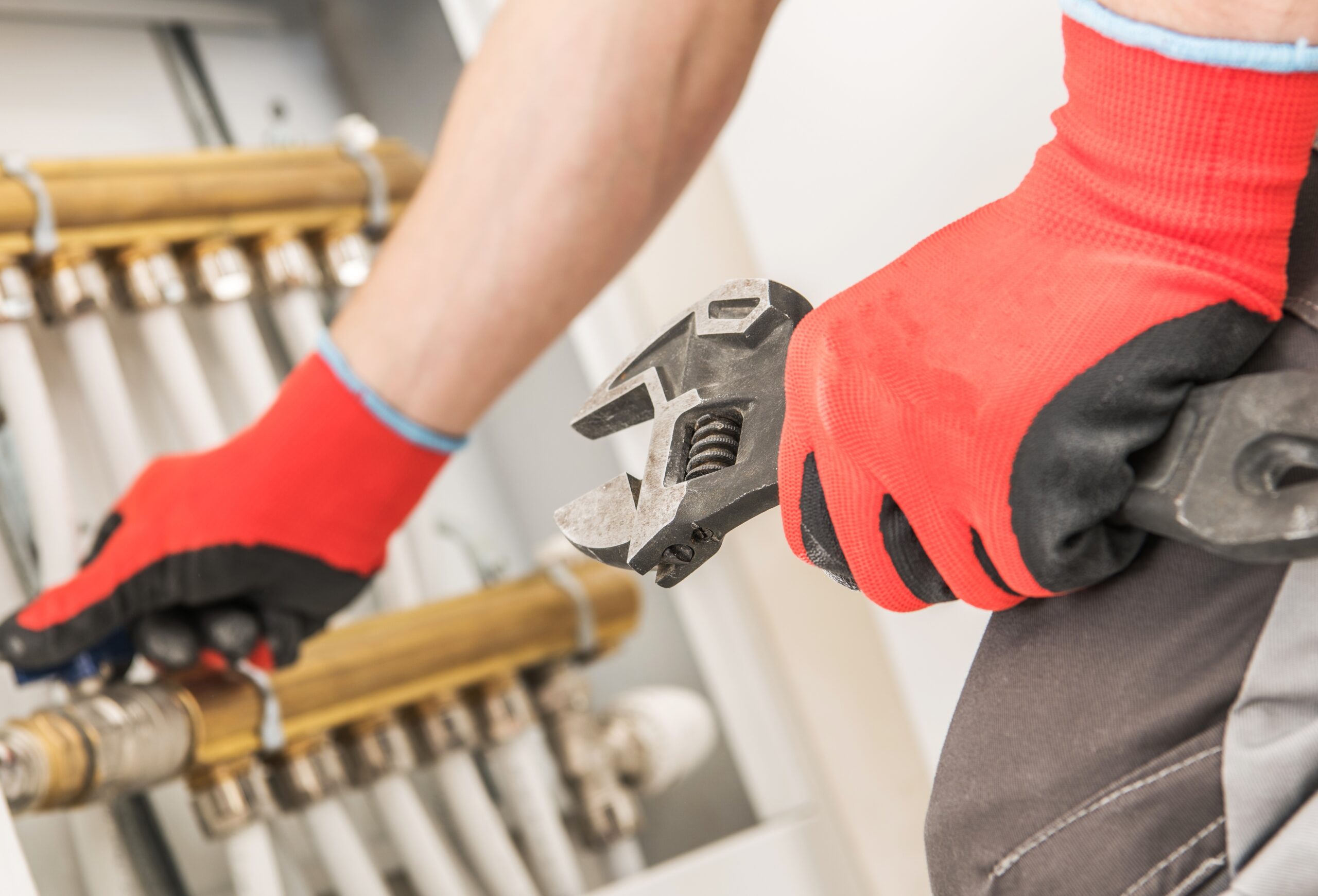 Caucasian Plumber Looking For Issue in the Heating System.
